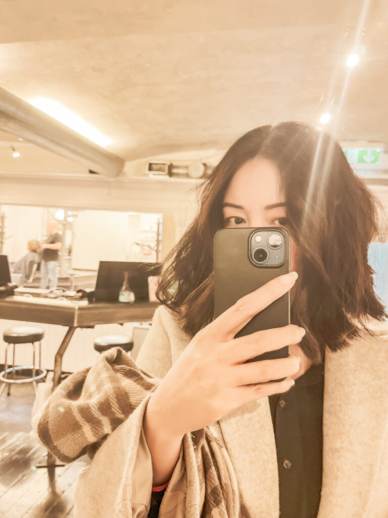 Woman taking a selfie in the mirror